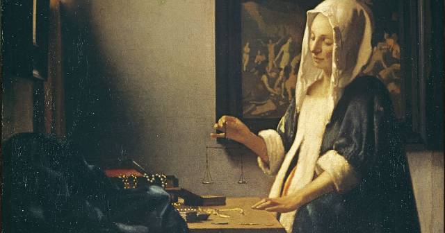 WOMAN HOLDING A BALANCE BY VERMEER